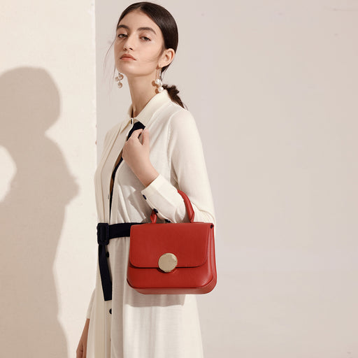Circular push lock crossbody bag deals